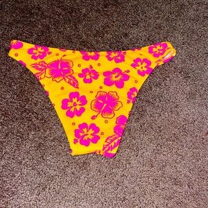 Flower bathing suit bottoms, color pink and yellow, size M, brand xhilaration